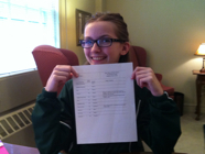 Megan proudly displays another awesome 8th grade progress report!