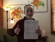 A 7th grader, Isabel is proud of her stellar Algebra test results!